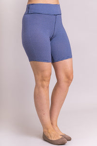 Women's blue plaid print biker shorts for yoga, workout, or casual wear. Made with comfortable, stretchy, and sustainable natural fibers.