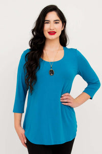 Woman wearing a vibrant blue 3/4 sleeve bamboo top, front view