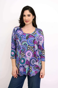 Front view of model wearing Jazz 3/4 top in vibrant Carnival print