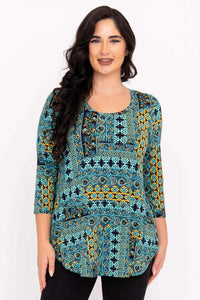 Front view of model wearing a teal and yellow patterned 3/4 sleeve bamboo tunic