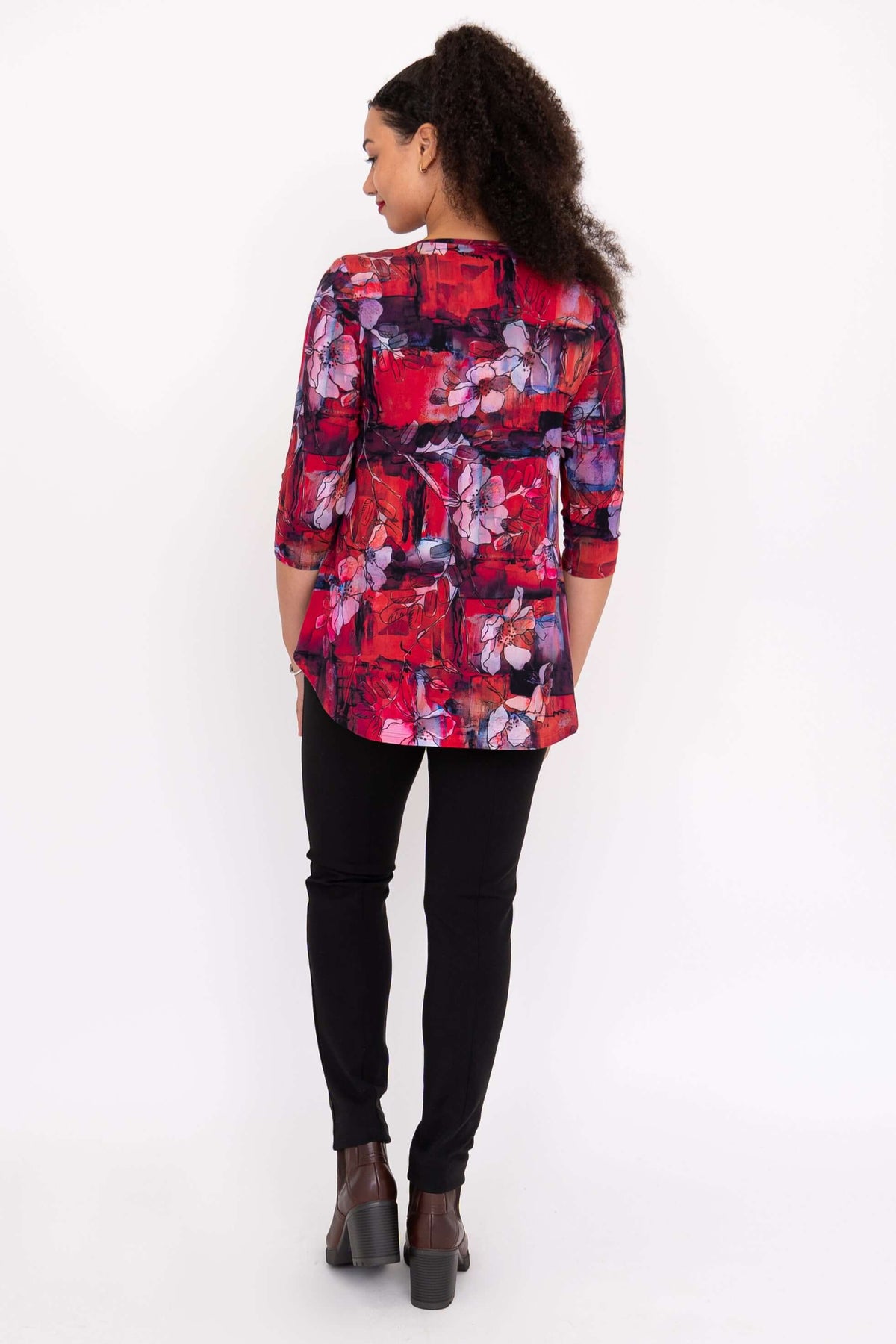 Back view of model wearing a floral red and purple Jazz 3/4 sleeve bamboo top