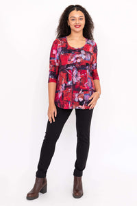 Model in Jazz 3/4 sleeve floral bamboo top and black pants, standing with hands by sides