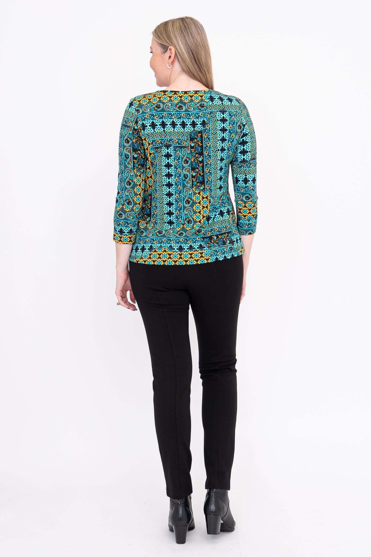 Back view of woman wearing Margorie 3/4 sleeve fitted tee with colorful print