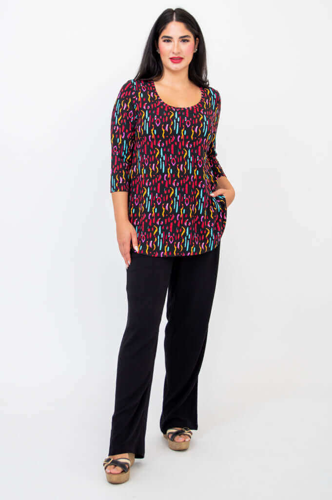 Model with hand in pocket in Jazz 3/4 Sleeve Top and black pants