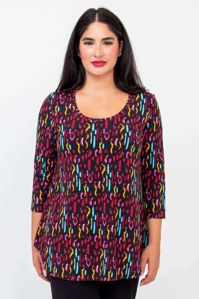 Front view of model wearing Jazz 3/4 Sleeve Top in colorful prism print