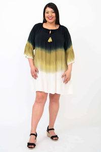 Woman modeling the Ellie Dress, showing 3/4 ruffle sleeves and keyhole tassel neckline