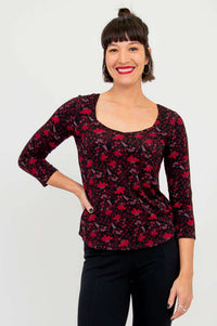 Front view of model wearing Ritzy Top in Lotus Black with 3/4 sleeves