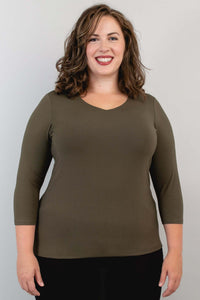 Model wearing olive green 3/4 sleeve V-neck bamboo top, front view