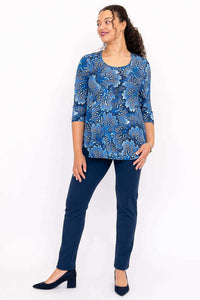 Woman posing in blue bamboo 3/4 sleeve top and navy pants, front view