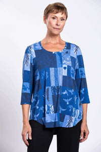 Model wearing blue patchwork 3/4 sleeve bamboo top, close-up view