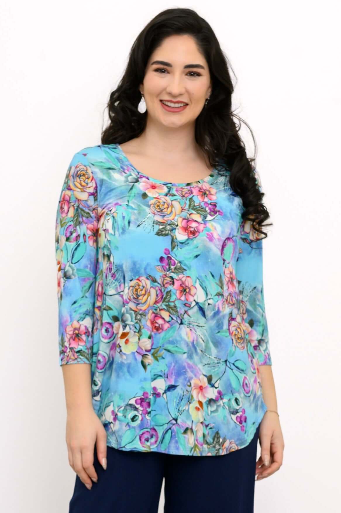 Woman wearing a blue floral 3/4 sleeve bamboo top, front view