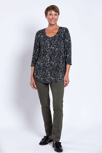 Woman standing front-facing in black floral 3/4 sleeve bamboo top and olive pants