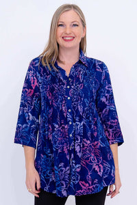 Front view of model wearing blue and pink floral Cindy smocked blouse with 3/4 sleeves