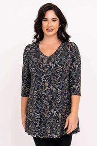 Front view of model wearing a dark floral bamboo tunic with 3/4 sleeves