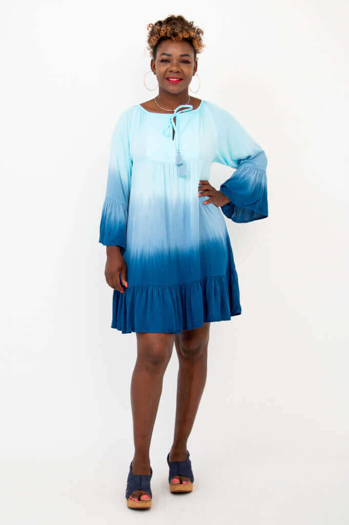 Front view of model wearing blue ombre Ellie Dress with ruffle hem and 3/4 sleeves