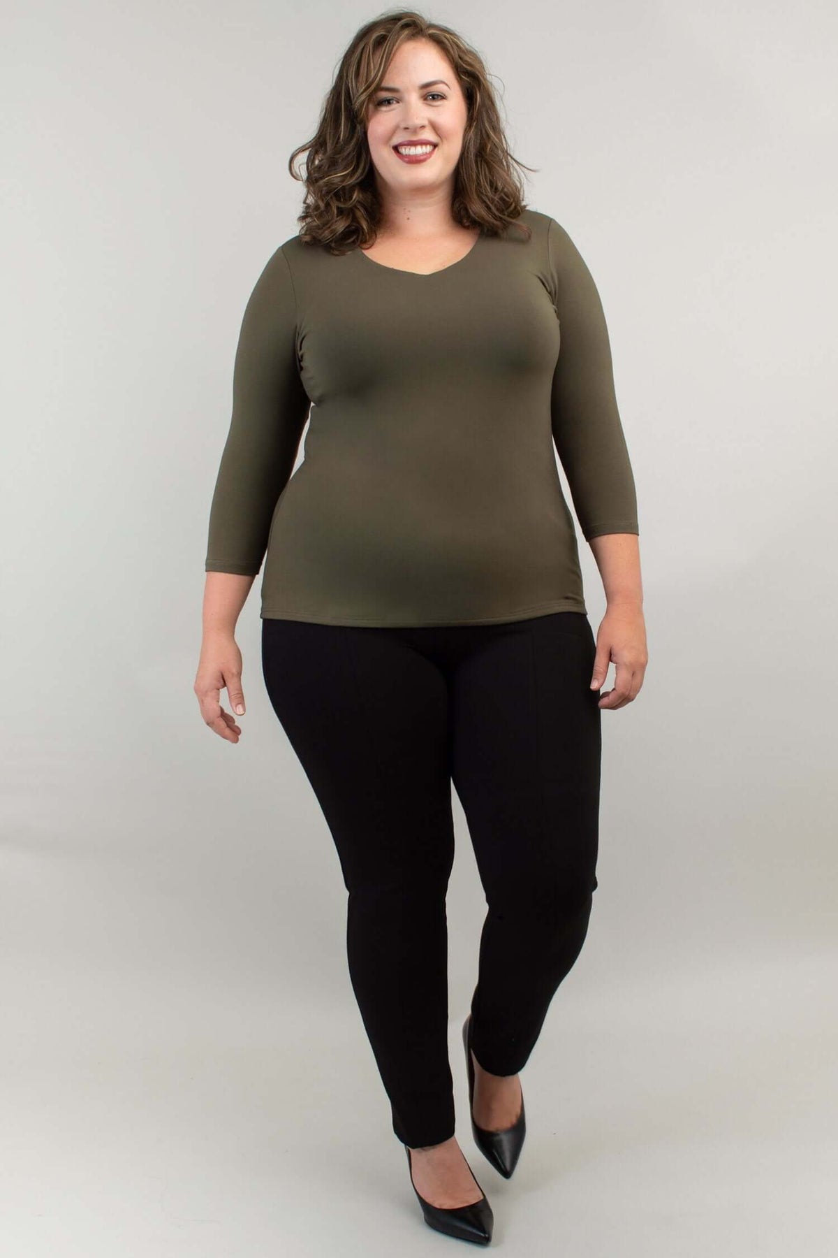 Back view of model wearing olive green bamboo top with 3/4 sleeves