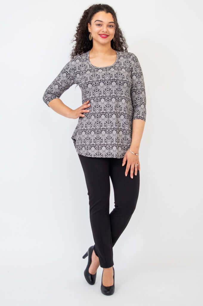 Model posing in Jazz Bamboo Top, black damask, full body view showing flowy fit and 3/4 sleeves