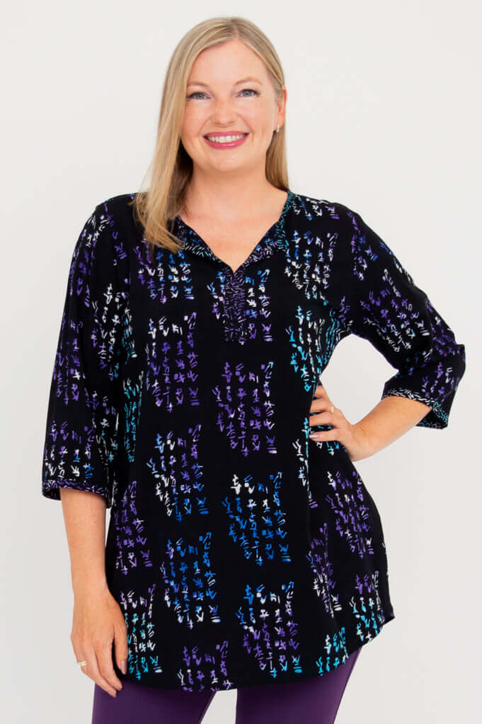 Front view of a woman wearing a black Batik Kary Blouse with 3/4 sleeves