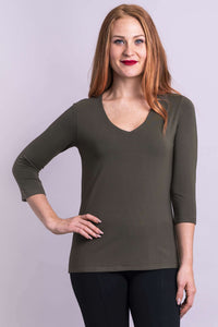 Model in olive green bamboo top with 3/4 sleeves, front angle