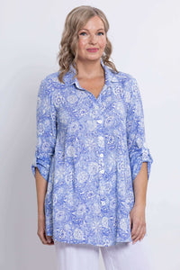 Woman wearing a blue paisley bamboo linen tunic with 3/4 tabbed cuffs, front view