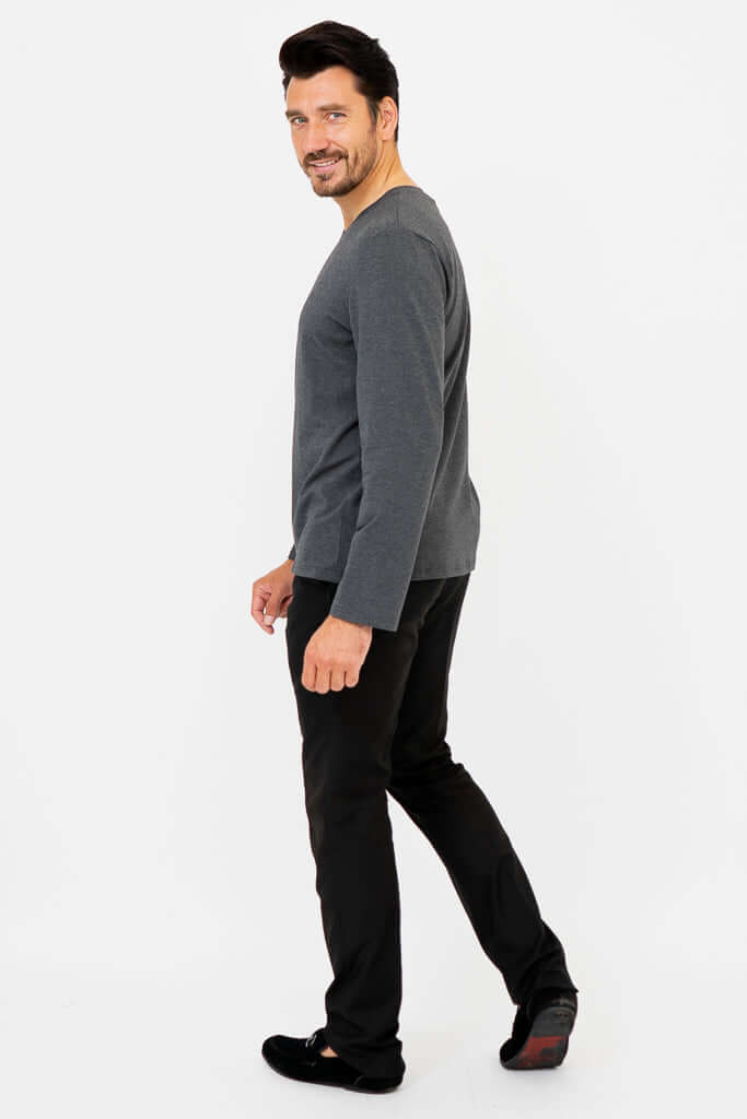 Man turning back, showcasing charcoal V-neck long sleeve shirt