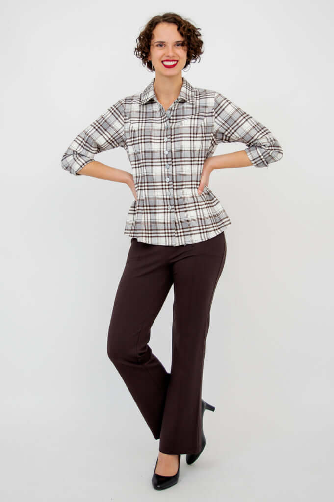 Model smiling, arms at waist, Alexis Top shown in full body