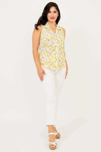 Angled front view of model in Lexa yellow floral sleeveless shirt
