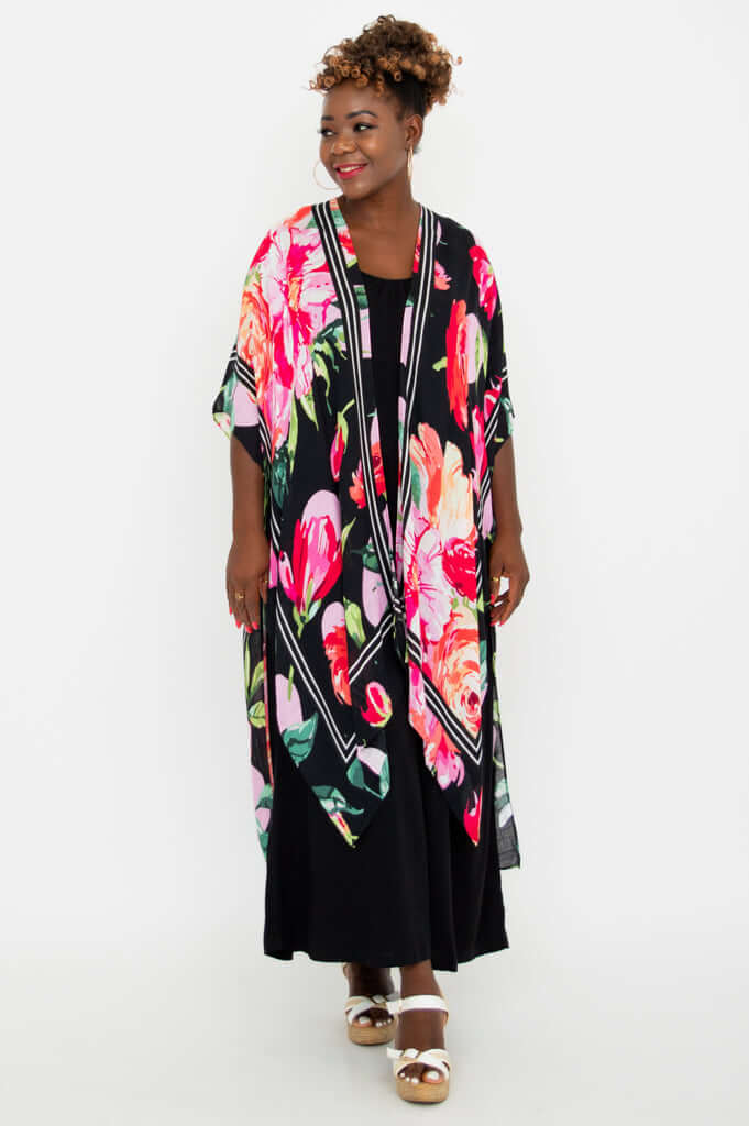 Front angled view of model in Darcy kimono wrap showing floral pattern and fluid hemline