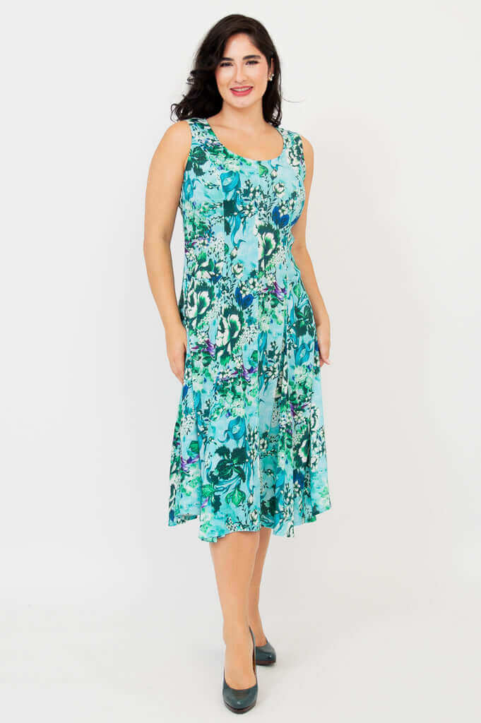 Front angled view of a woman modeling an aqua floral mid-calf dress