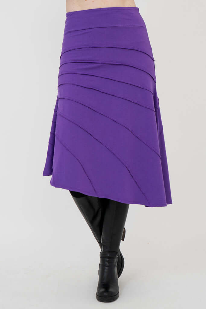 Angled front view of Beverly Skirt in purple showing layered seam details