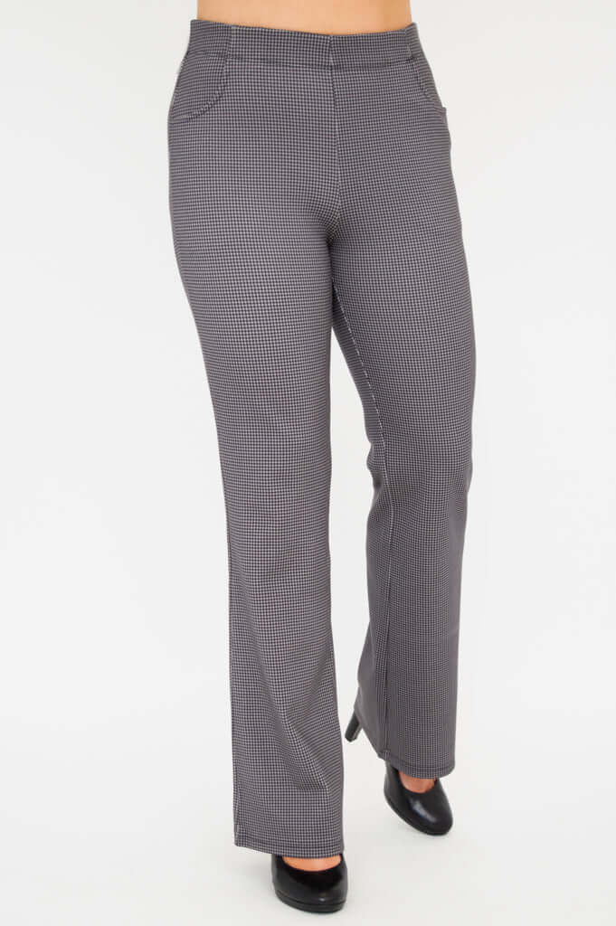 Angled front view of Sasha bootcut pants stepping forward