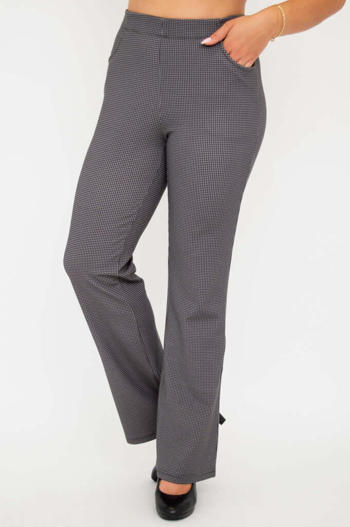 Angled front view of Sasha bootcut pants with hand in pocket
