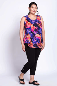 Angled front view of model in Jazz Tank Violet Aura and black pants