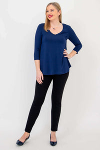 Pose from angle in Jackie V-neck bamboo top and black pants