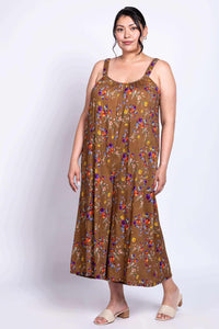 Person wearing a brown floral jumpsuit with sweetheart neckline, angled view