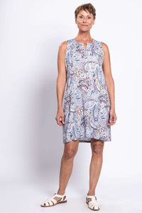 Three-quarter view of woman modeling sleeveless paisley print shift dress with front pockets
