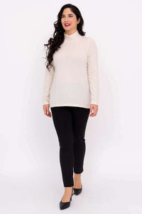 Angled view of model walking in Simmon Sweater with mock neck