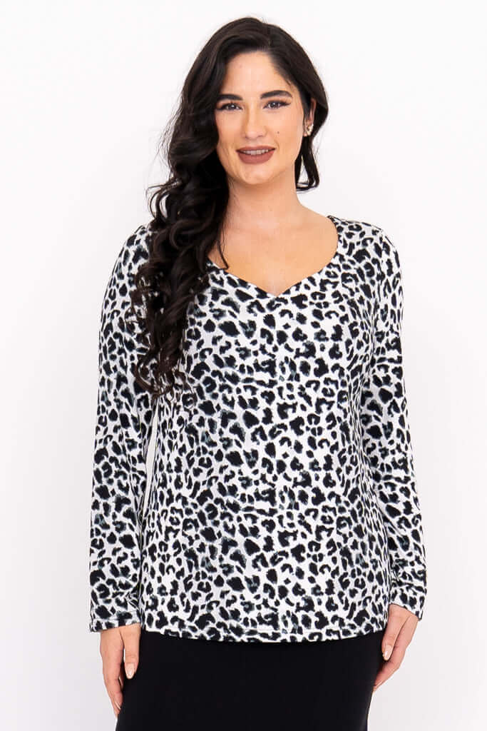 Front view of model wearing Annette long sleeve top in wild animal print