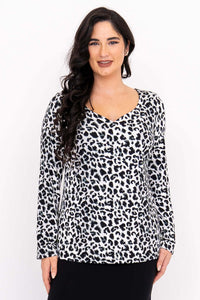 Front view of model wearing Annette long sleeve top in wild animal print