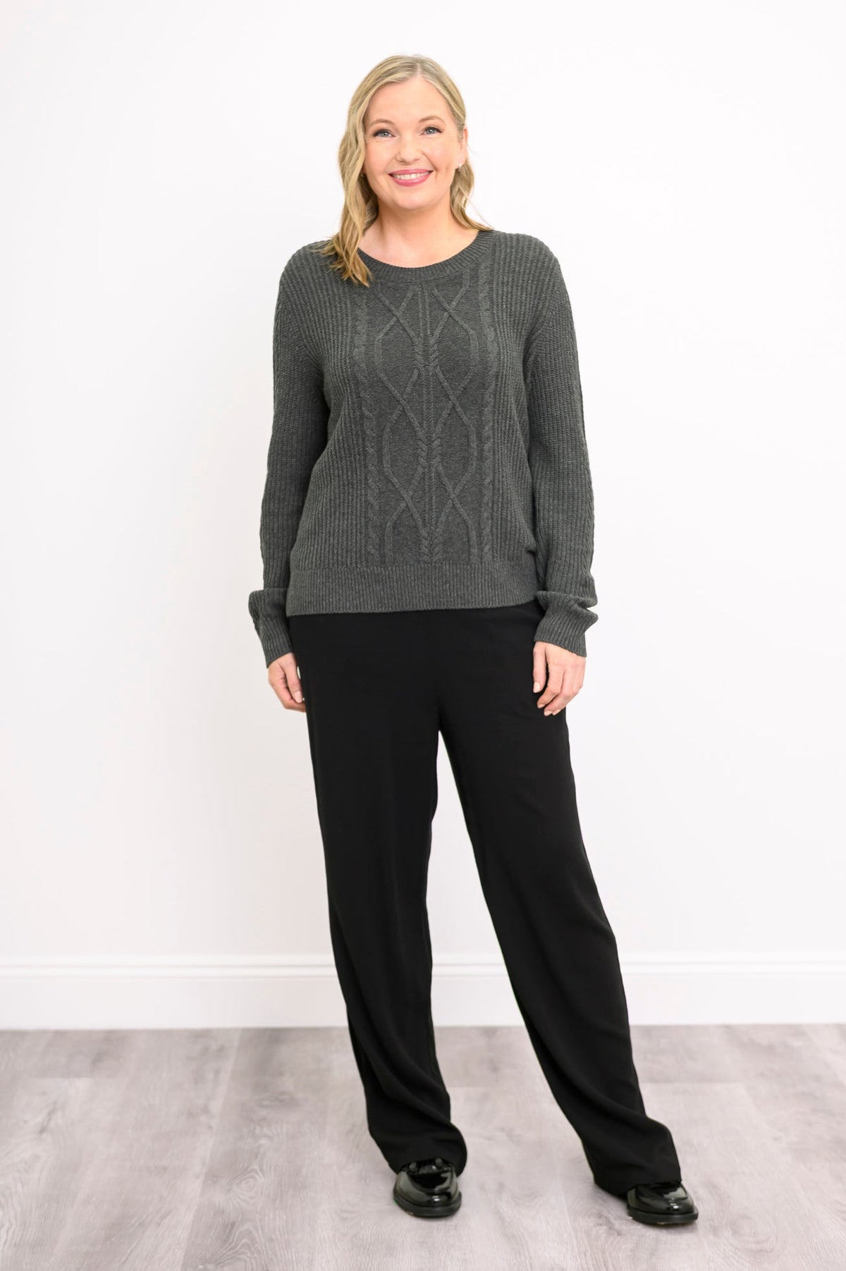 Front-facing shot of a graphite patterned sweater, illustrating a comfortable, relaxed-fit drape.