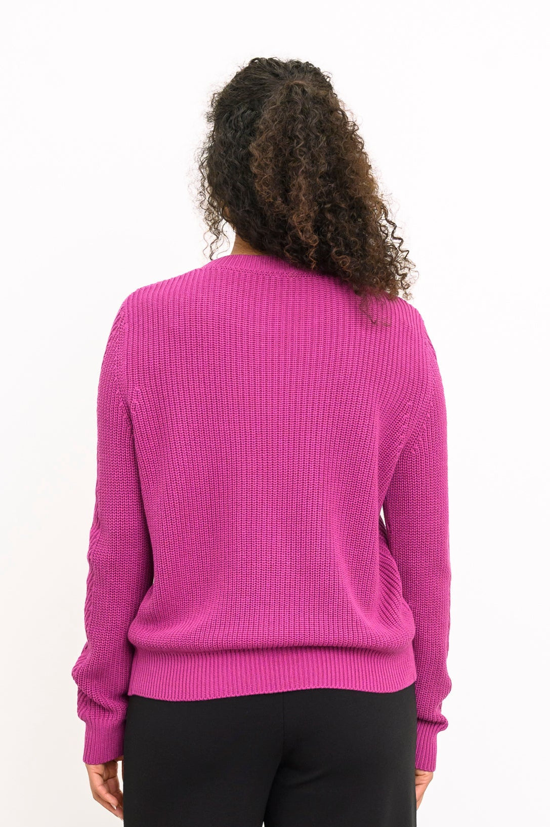 Rear view of a textured magenta cotton-blend pullover, highlighting its classic fit and comfortable length