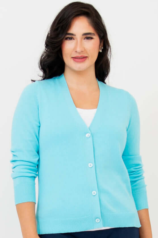 Front view of woman wearing aqua blue button-up cardigan with V-neck