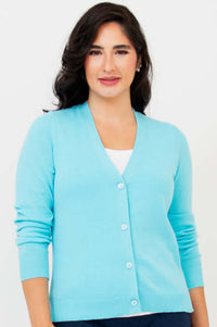 Front view of woman wearing aqua blue button-up cardigan with V-neck