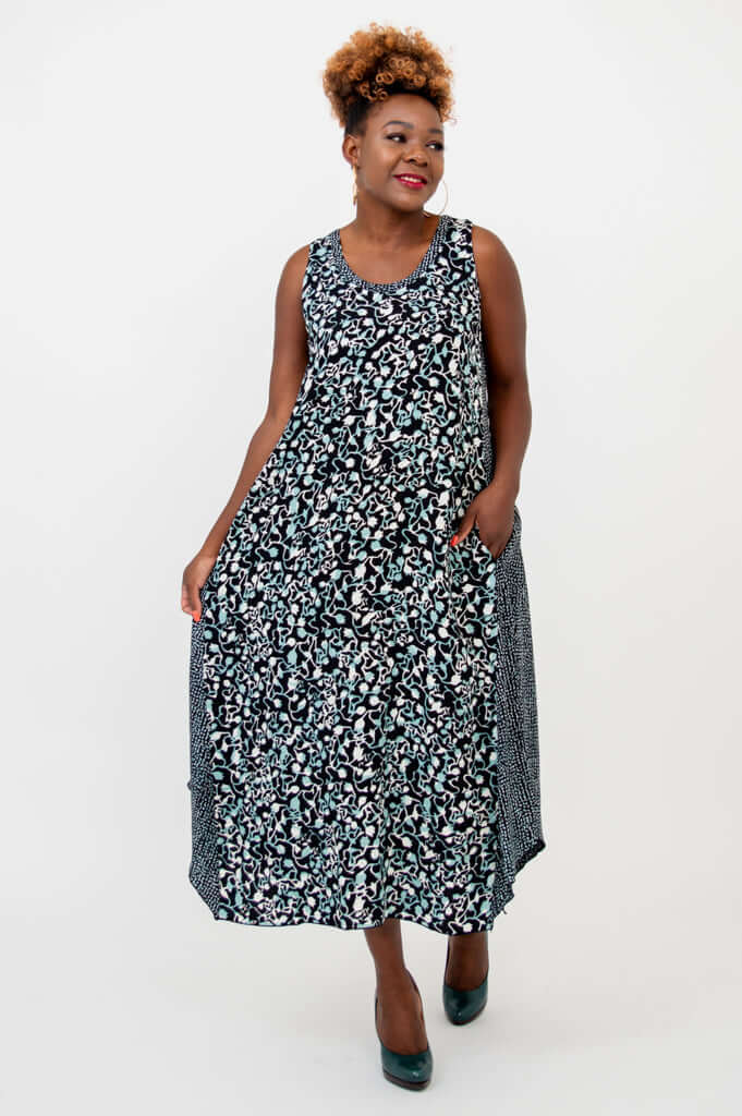 Model walking in a black and blue lightweight midi tank dress with pockets