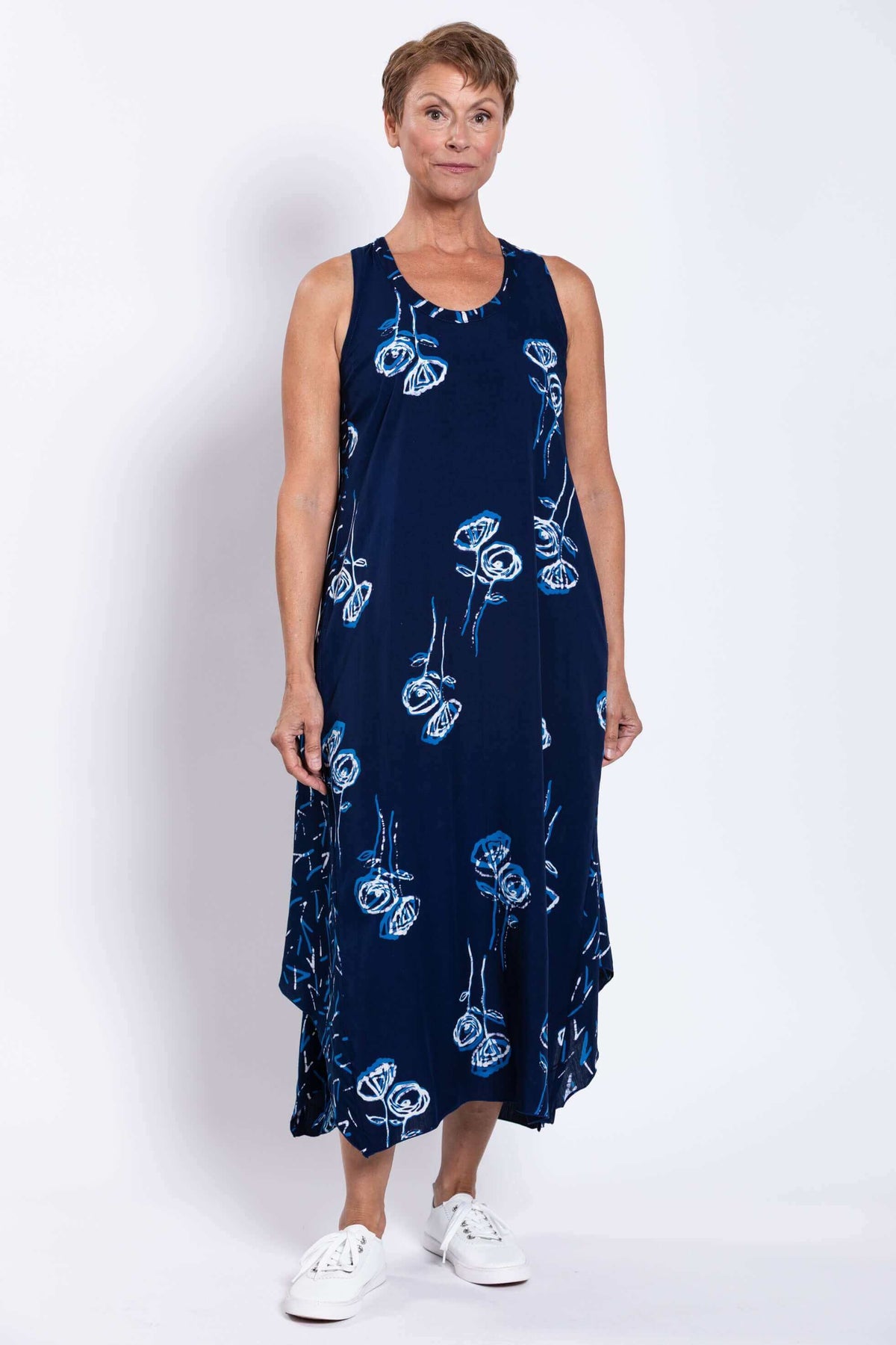 Full-length front view of Ari indigo floral tank dress on model