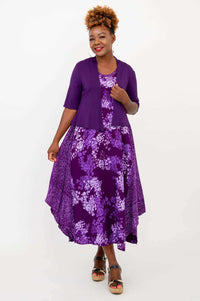 Woman in purple floral tank midi dress styled with a matching purple cardigan