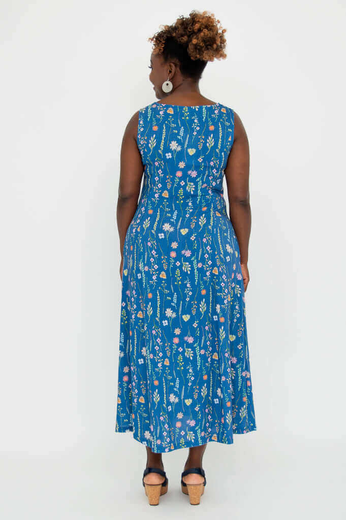 Back view of model in Madison maxi dress with blue wildflower pattern