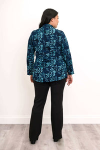 Back view of model showing blue floral long sleeve shirt