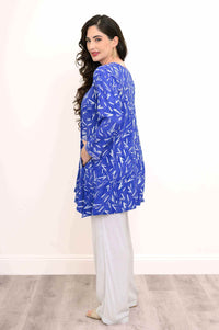 Back and side view of blue tunic with contrast details on woman