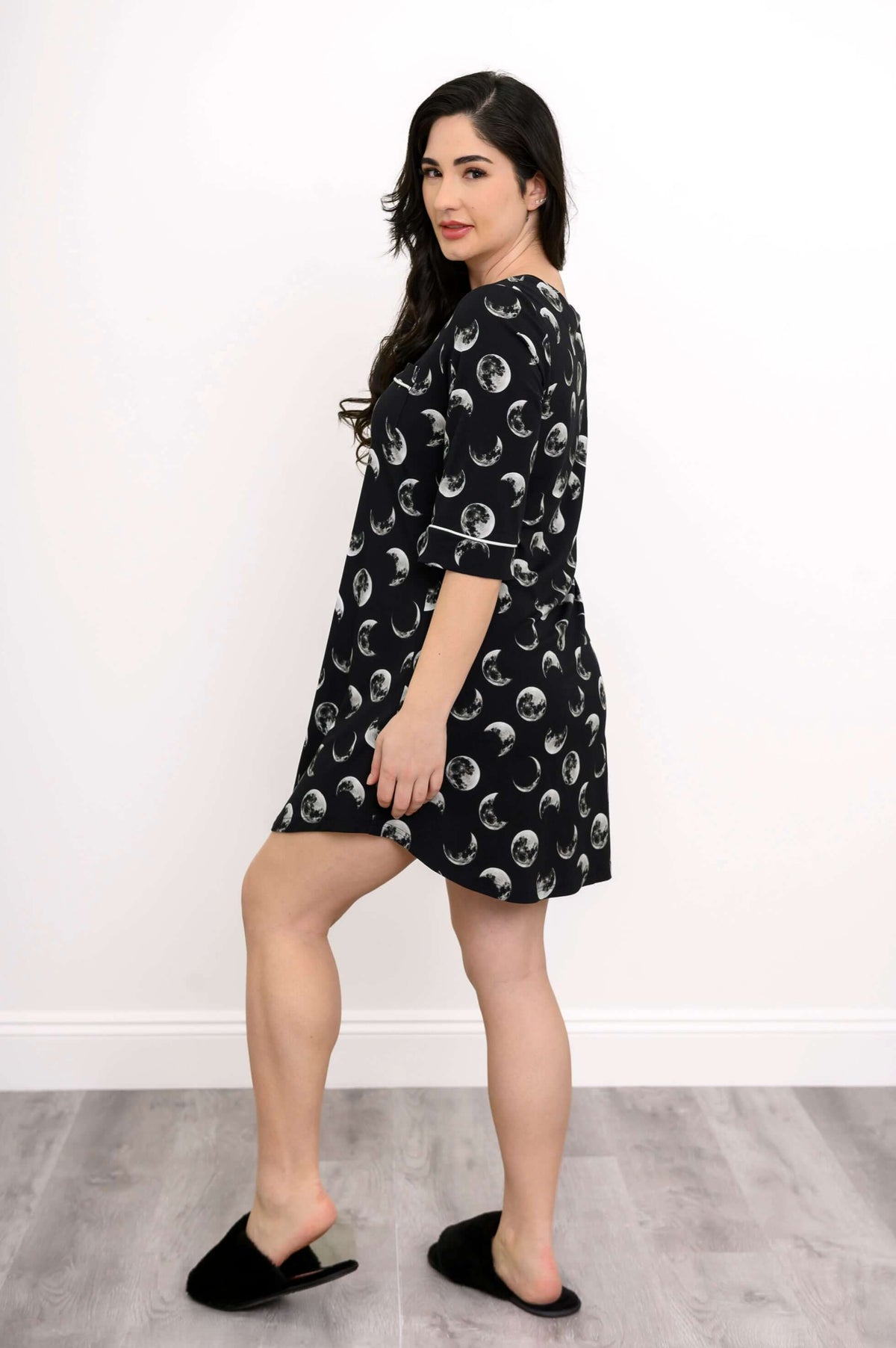 Back and side view of woman in a moon phase bamboo sleepshirt with piping details